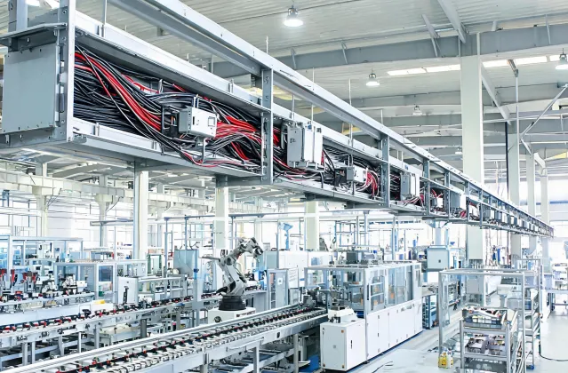 Cable tray along manufacturing line